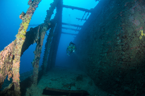 Diver swims down the starboard passageway